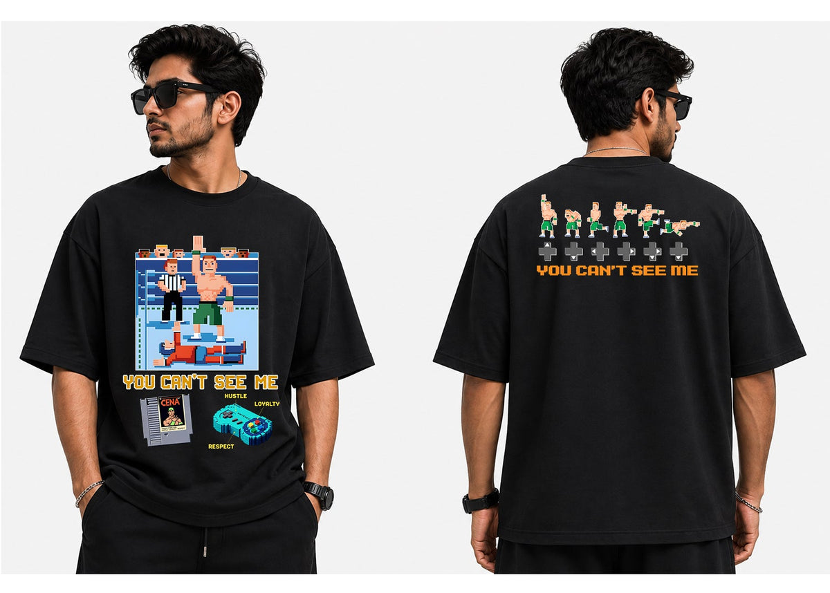 A man modeling a black graphic t-shirt from both the front and back views against a plain white background. The front features a colorful boxing ring graphic with the text 'YOU CAN'T SEE ME' in yellow.