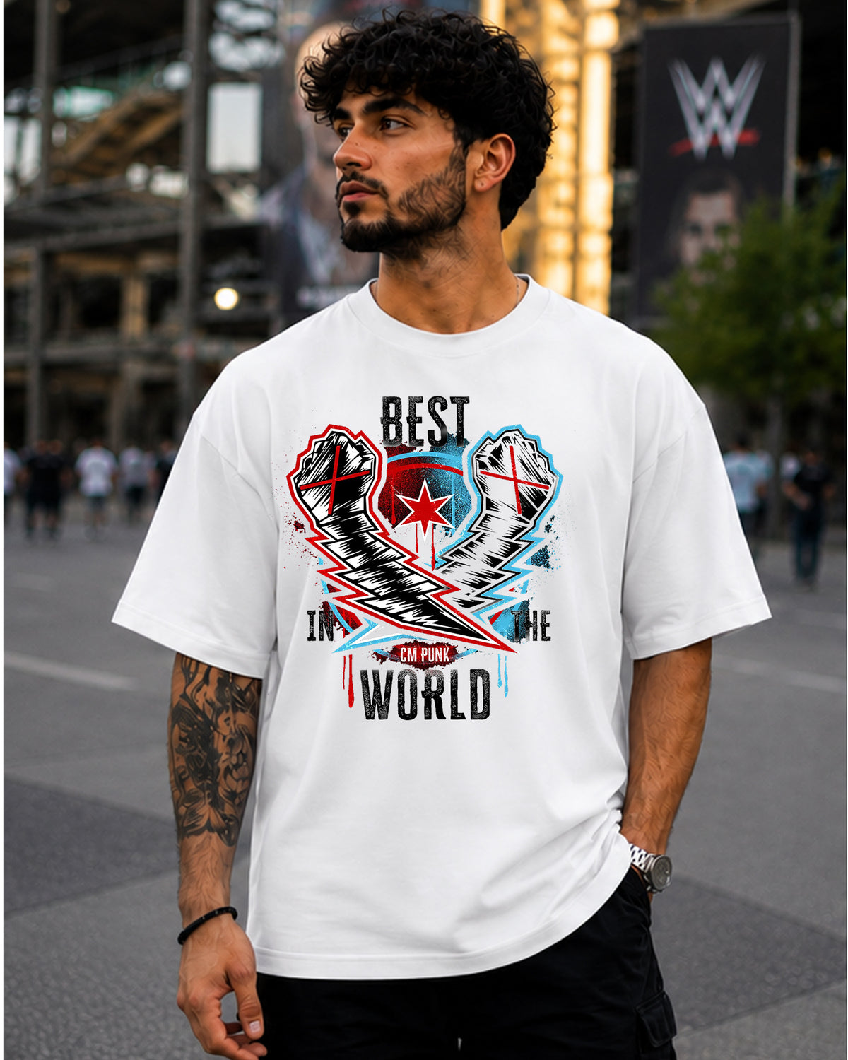 Best in the World wrestling inspired white graphic t-shirt with crossed taped fists, championship-inspired artwork and distressed typography front view | WrestleHub India
